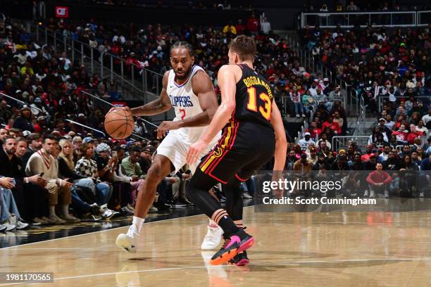 Kawhi Leonard of the LA Clippers dribbles the ball during the game against the Atlanta Hawks on February 5, 2024 at State Farm Arena in Atlanta,...