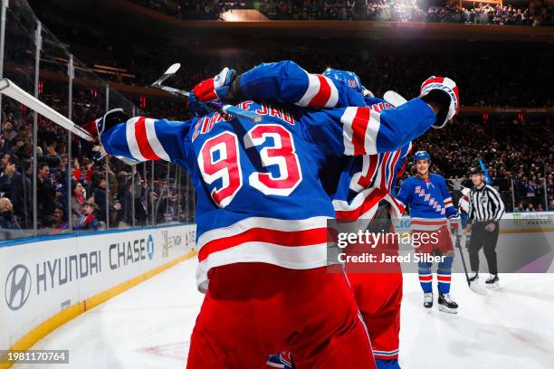 Artemi Panarin of the New York Rangers celebrates with teammates after scoring a goal in the third period against the Colorado Avalanche at Madison...
