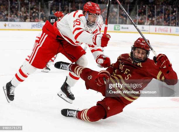 Sam Stevens of the Boston University Terriers dumps Jack Malone of the Boston College Eagles during the second period of the semifinals of the...