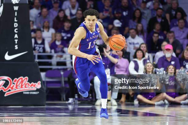 Kansas Jayhawks guard Kevin McCullar Jr. Brings the ball up court in the second half of a Big 12 basketball game between the Kansas Jayhawks and...