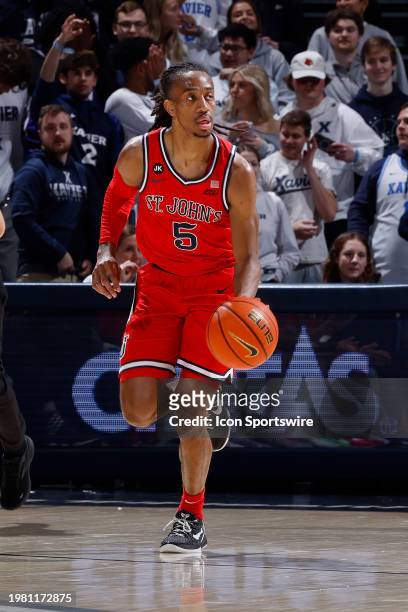 St. John's Red Storm guard Daniss Jenkins brings the ball up court during a college basketball game against the Xavier Musketeers on January 31, 2024...