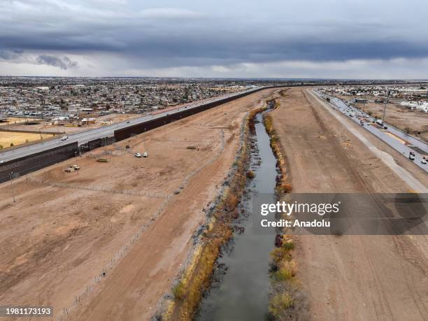 An aerial view of a border wall and concertina wire barriers stand along the Rio Grande river between United States and Mexico on February 2, 2024 in...