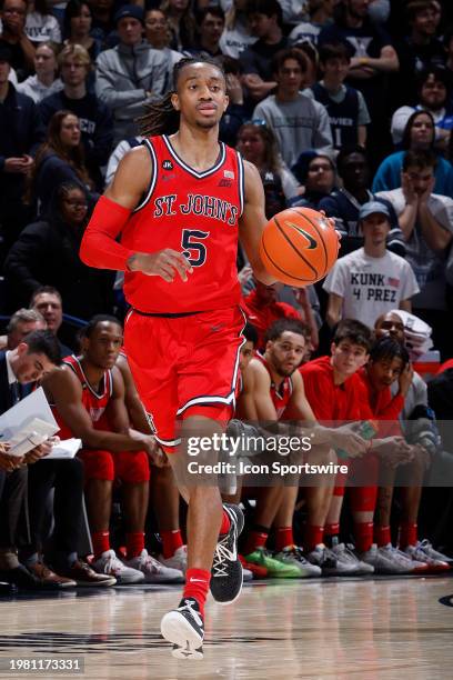 St. John's Red Storm guard Daniss Jenkins brings the ball up court during a college basketball game against the Xavier Musketeers on January 31, 2024...