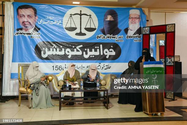 This photograph taken on January 30, 2024 shows YouTuber Zeba Waqar , an election candidate of the Jamaat-e-Islami , a right-wing party addressing...