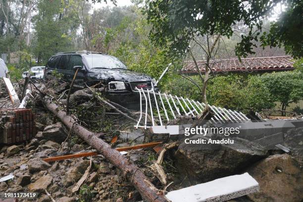 Car is stuck in mud after severe storms hit Southern California, causing flooding and mud slides on February 5 in Studio City, California.