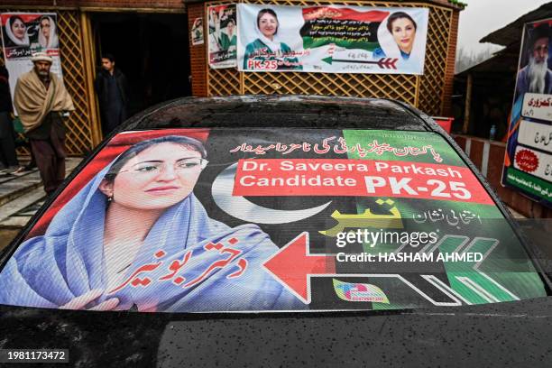 This photograph taken on January 31, 2024 shows election posters for Saveera Parkash, a Hindu minority candidate of the Pakistan Peoples Party for...