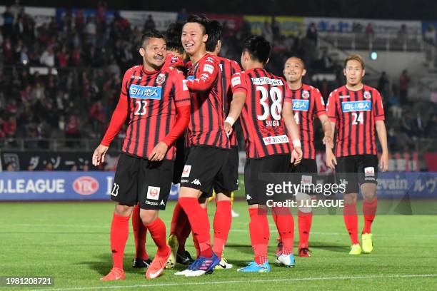 Diego Macedo of Consadole Sapporo celebrates with teammatesafter scoring the team's second goal during the J.League YBC Levain Cup Group A match...