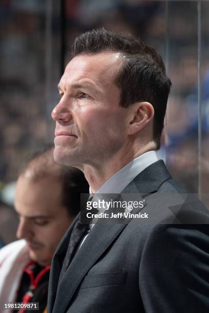 Head coach Luke Richardson of the Chicago Blackhawks looks on from the bench during their NHL game against the Vancouver Canucks at Rogers Arena on...
