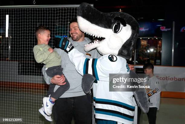 Tomas Hertl of the San Jose Sharks interacts with mascot SJ Sharkie of the San Jose Sharks during the EA SPORTS NHL 24 All-Star Open at the Hockey...