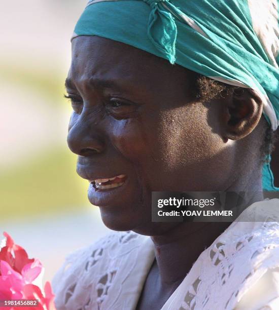 Democratic Republic of Congo woman cries as the coffin of slained president Laurent Kabila arrives 21 January 2001 at the People's Palace in Kinshasa...