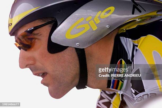 Spanish Abraham Olano concentrates before the first stage of the 87th Tour de France, an individual time-trial around the 'Futuroscope' in Poitiers,...