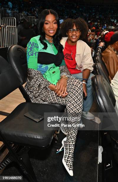 Personality Marlo Hampton and her nephew attend the game between the Phoenix Suns and Atlanta Hawks at State Farm Arena on February 02, 2024 in...