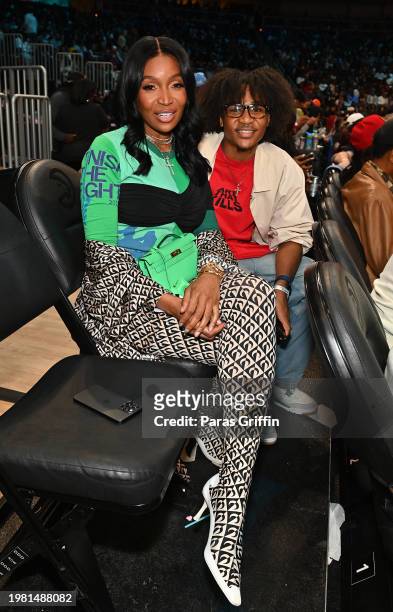Personality Marlo Hampton and her nephew attend the game between the Phoenix Suns and Atlanta Hawks at State Farm Arena on February 02, 2024 in...