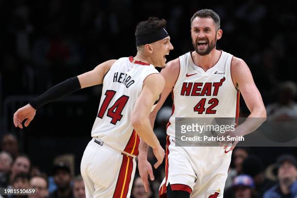 Kevin Love of the Miami Heat celebrates with teammate Tyler Herro against the Washington Wizards during the second half at Capital One Arena on...
