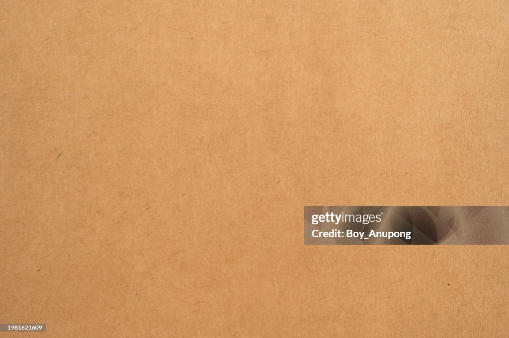 Full frame shot of flat brown envelope texture and background. This product allows for small and flat objects to be posted.