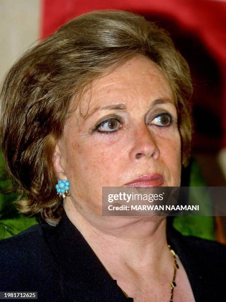 Jihan al-Sadat, wife of the late Egyptian President Anwar al-Sadat, sits at the tomb of Shah Mohammed Reza Pahlavi at the Rifai mosque in Cairo 26...