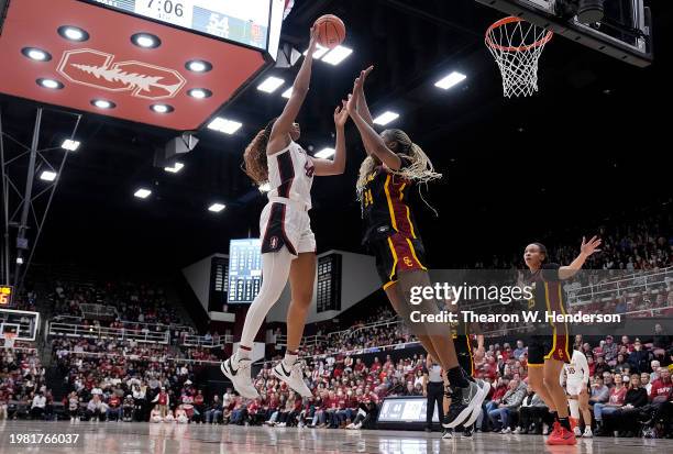 Kiki Iriafen of the Stanford Cardinal shoots over Clarice Akunwafo of the USC Trojans during the fourth quarter at Stanford Maples Pavilion on...