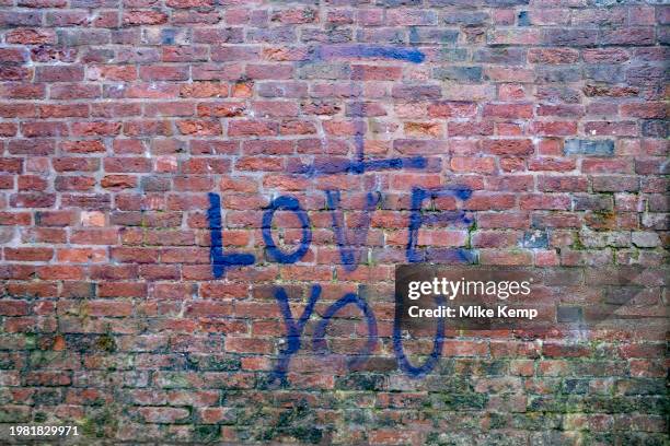 Love you graffiti spray painted on a wall in Kings Heath on 4th January 2024 in Birmingham, United Kingdom.