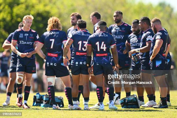 Rebels players form a huddle during the Super Rugby Pacific Trial Match between Melbourne Rebels and NSW Waratahs at Harold Caterson Reserve on...
