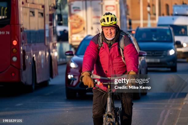 Cyclists cycling across Tower Bridge on 16th January 2024 in London, United Kingdom. Cycling is a very popular mode of transport in the capital as...