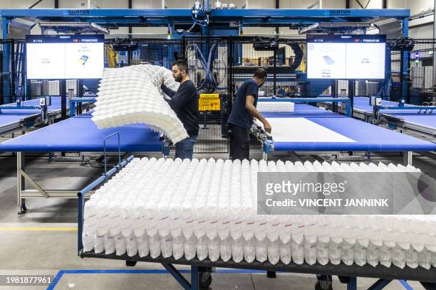 The production of circular mattresses at the new Auping factory in Deventer on February 6, 2024. In the factory, the bed manufacturer only makes...