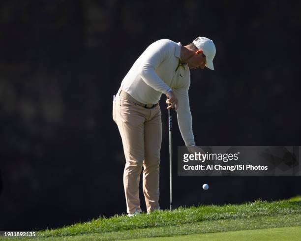 Rory McIlroy of Northern Ireland taking a drop on hole during the second round of the 2024 AT&T Pebble Beach Pro-Am at Pebble Beach Golf Links on...