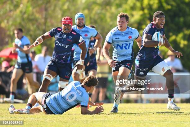 Angelo Smith of the Rebels runs with the ball during the Super Rugby Pacific Trial Match between Melbourne Rebels and NSW Waratahs at Harold Caterson...