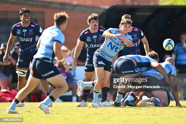 Teddy Wilson of the Waratahs passes the ball during the Super Rugby Pacific Trial Match between Melbourne Rebels and NSW Waratahs at Harold Caterson...