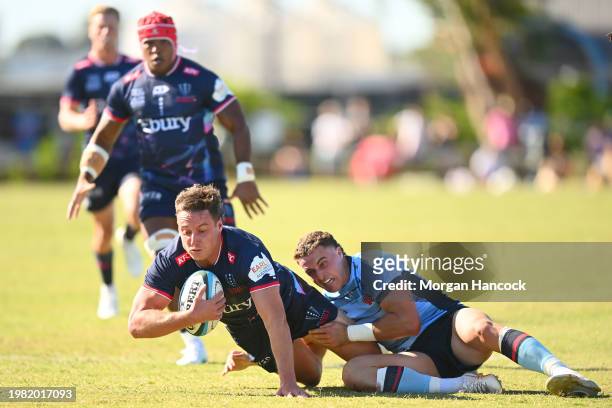 Nick Jooste of the Rebels is tackled during the Super Rugby Pacific Trial Match between Melbourne Rebels and NSW Waratahs at Harold Caterson Reserve...