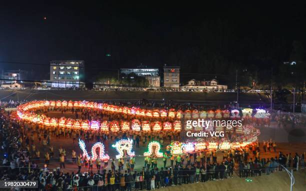 People perform wooden-bench dragon dance as Spring Festival approaches on February 2, 2024 in Longyan, Fujian Province of China. The wooden-bench...