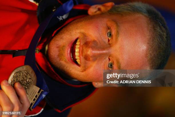 Alain Baxter of Great Britain celebrates his bronze medal in the Men's Slalom during ceremonies at the XIX Winter Olympics 23 February 2002 in Salt...