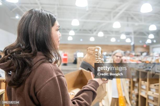 millenial shows boot to senior grandmother in orlando florida - orlando florida family stock pictures, royalty-free photos & images