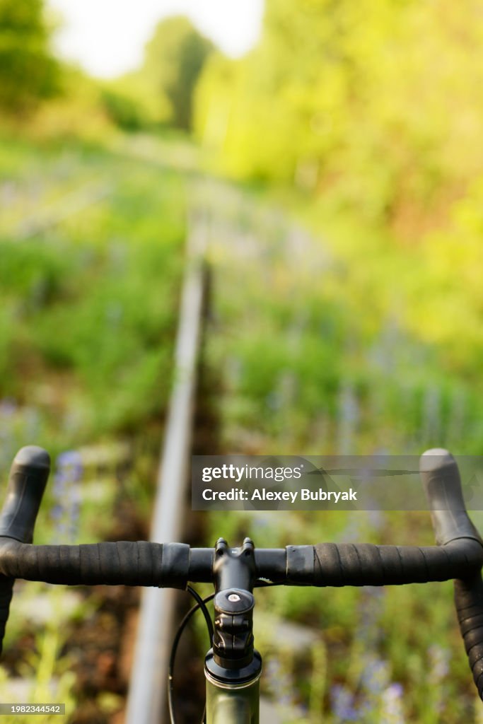Gravel Bicycle on on Foot Path, personal perspective view of handlebars