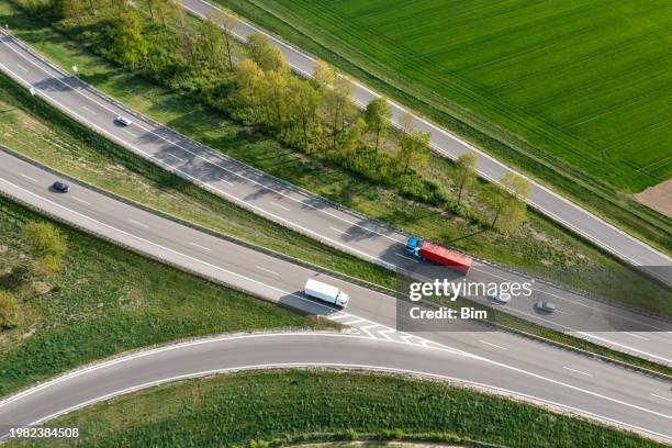 rural highway junction from above - trucks stock pictures, royalty-free photos & images