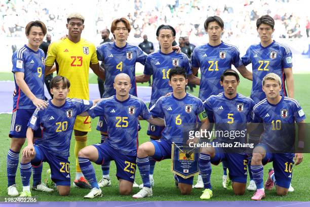 The players of Japan pose for a team photo prior to kick-off ahead of the AFC Asian Cup quarter final match between Iran and Japan at Education City...