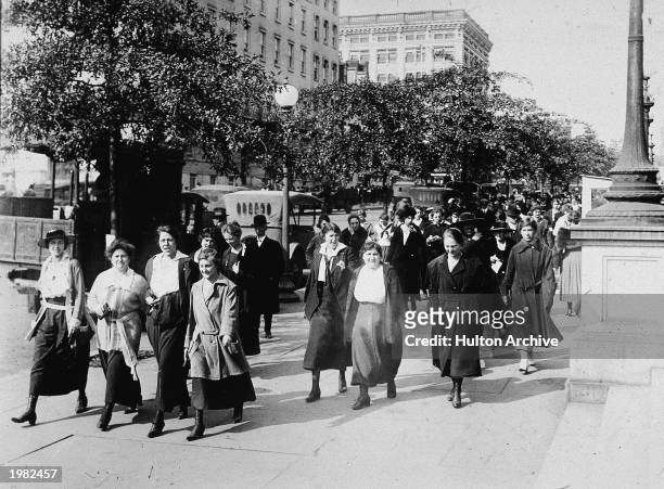 Women from the Department of War take 15-minute walks to breathe in fresh air every morning and night to ward off the influenza virus during World...