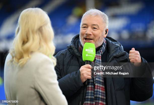 Ally McCoist interacts with a colleague prior to the Premier League match between Everton FC and Tottenham Hotspur at Goodison Park on February 03,...