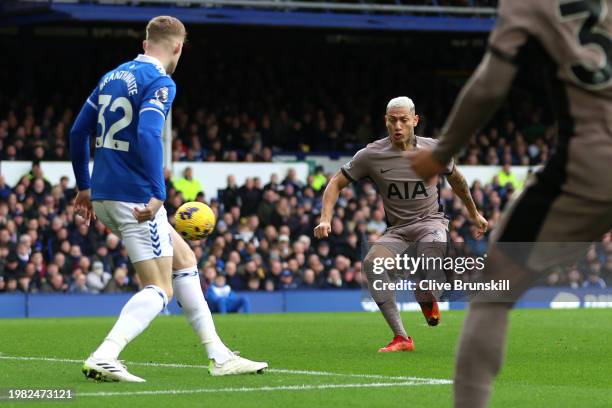 Richarlison of Tottenham Hotspur scores his team's first goal during the Premier League match between Everton FC and Tottenham Hotspur at Goodison...