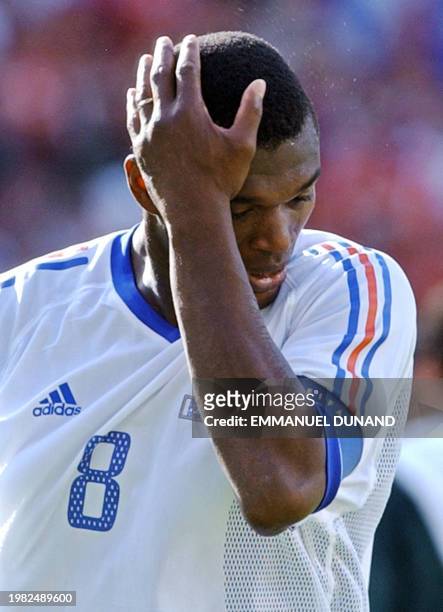 French captain Marcel Desailly reacts as he walks off the pitch, 11 June 2002 at the Incheon Munhak Stadium in Incheon, after the first round Group A...