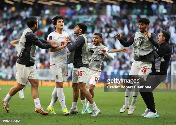 Sardar Azmoun of Iran celebrates with teammates after scoring his team's second goal before being disallowed during the AFC Asian Cup quarter final...