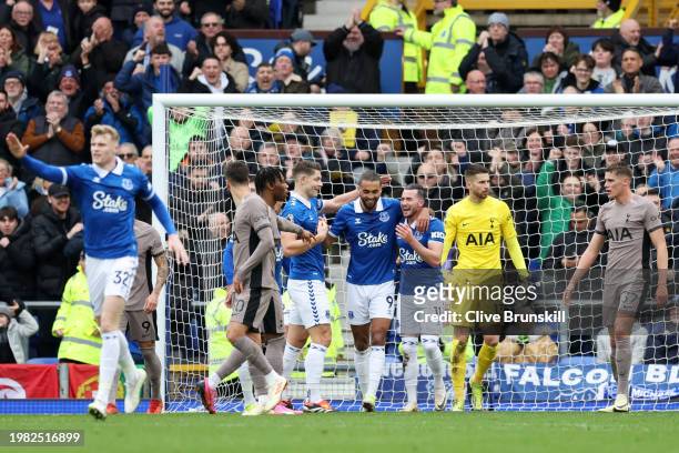 Dominic Calvert-Lewin of Everton celebrates scoring his team's first goal with teammates Jack Harrison and James Tarkowski during the Premier League...