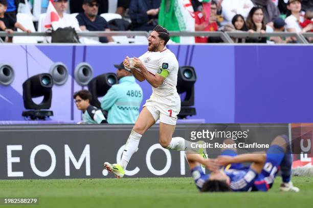 Alireza Jahanbakhsh of Iran celebrates victory after the whistle during the AFC Asian Cup quarter final match between Iran and Japan at Education...