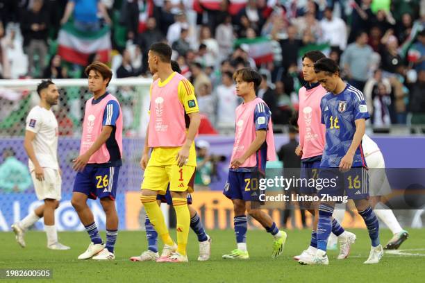 The players of Japan look dejected as they leave the field at full-time following the teams defeat in during the AFC Asian Cup quarter final match...