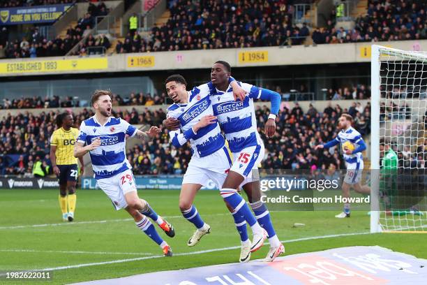 Harvey Knibbs, Kelvin Ehibhatiomhan and Lewis Wing of Reading celebrate their team's first goal, an own-goal scored by Ciaron Brown of Oxford United...