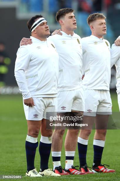 Jamie George, Tommy Freeman and Fin Smith of England sing their national anthem prior to kick-off ahead of the Guinness Six Nations 2024 match...