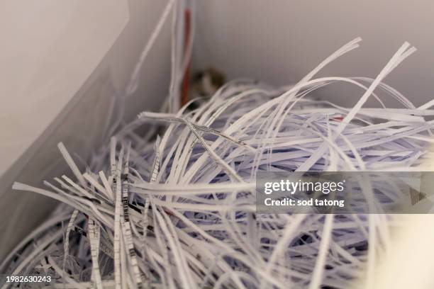 big stack of shredded documents to protect confidential information, safety is first concept, background, top view, closeup - geschreddert stock-fotos und bilder