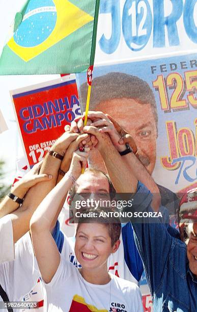 Brazilian presidential candidate for the Social Progressive Party, Ciro Gomes, holds a flag with his wife Patricia Pilar, during a political campaign...