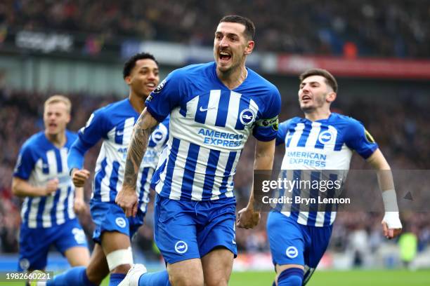 Lewis Dunk of Brighton & Hove Albion celebrates scoring his team's first goal during the Premier League match between Brighton & Hove Albion and...