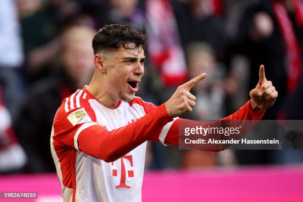 Aleksandar Pavlovic of Bayern Munich celebrates scoring his team's first goal during the Bundesliga match between FC Bayern München and Borussia...