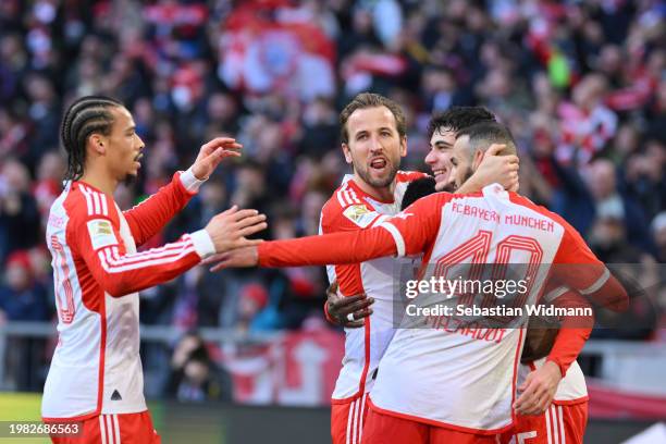 Aleksandar Pavlovic of FC Bayern München celebrates with team mates Leroy Sane, Harry Kane and Nouassir Mazraoui after scoring his team's first goal...